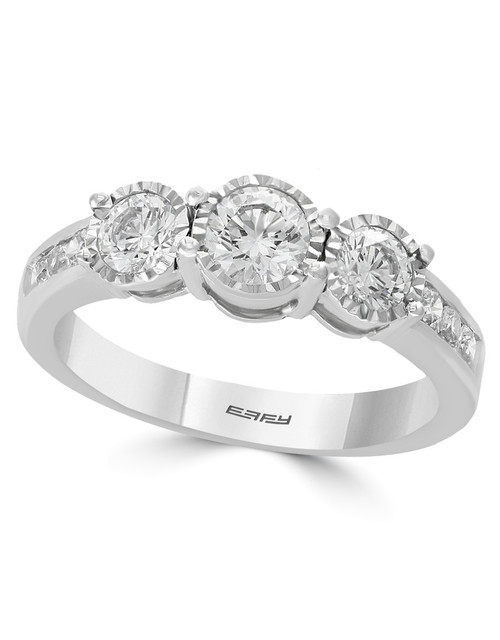 The three-diamond ring placed upright against a pure white (#FFFFFF) glossy background, showcasing the central diamond trio and the delicate pavé diamonds down the band with a high-end, crisp reflection and no harsh shadows.