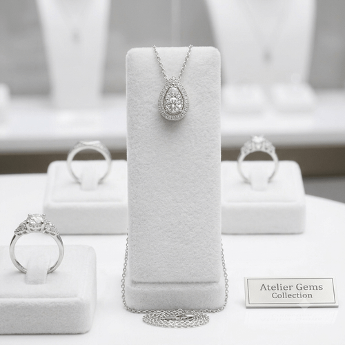 EFFY 14K white gold 0.34 ctw diamond pear-shaped halo pendant necklace displayed on a jewelry stand
