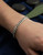 Men’s Cuban bracelet displayed on models wrist Atelier Gems