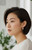 Rhodium finished sterling silver hoop earrings displayed white on Model