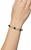 Atelier Gems Black opal bracelet displayed on jewelry hand model wrist