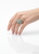 Natural green quartz ring displayed on jewelry display hand model