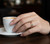 closeup 925Chic Sterling Silver  CZ Rainbow Baguette Ring Size 7 Rhodium Finish
 display on Models figure holding the cup