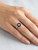 Close up of rose quartz square gemstone set in sterling silver ring