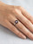 Close up of rose quartz square gemstone set in sterling silver ring