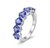 Close-up of the secure prong setting and 925 sterling silver on a natural tanzanite band.