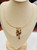 statement 14K gold amethyst necklace displayed on jewelry bust