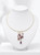 close-up of purple amethyst stones set in 14K gold pendant necklace