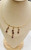 Unique 14K gold amethyst necklace displayed on jewelry bust
