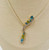close-up of natural blue topaz gemstones and diamonds in gold necklace