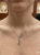 14K yellow gold blue topaz and diamond drop necklace front view model