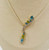 close-up of natural blue topaz gemstones and diamonds in gold necklace