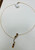 Luxury 14K gold cirtine ,garnet and diamond drop necklace on jewelry display