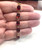 close-up 10K  Gold garnet gemstones in gold bracelet model
