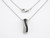 Black and white diamond twisted ribbon pendant on a delicate white gold chain.