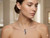 Lifestyle: Luxury 925 Chic diamond necklace presented in a minimalist white jewelry box.