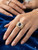 Close-up of a vibrant blue Ceylonese sapphire surrounded by brilliant-cut diamonds.