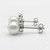Close-up shot showing the lustrous surface of the freshwater pearl and brilliant bezel diamond on an EFFY earring.