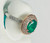 Effy at Atelier Gems A crisp, vertical bird's-eye perspective looking down into the 1.52-carat natural emerald, showcasing its premium clarity, cut orientation, and secure setting.