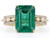 Effy at Atelier Gems Basket Gallery Detail A close-up profile shot focusing on the solid gold basket framework elevating the emerald, detailing the structural prongs and the thickness of the 1.86 DWT gold band.