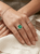 EFFY 2.19 ct emerald and diamond halo statement ring worn on a model’s hand