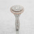 Side profile of EFFY two-tone oval diamond cluster ring showing the raised halo and split shank