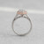 Rear view of EFFY oval diamond cluster ring showing the rose gold halo and white gold band