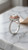Angled side view of EFFY 14K two-tone gold emerald-cut diamond ring showing the split-shank setting