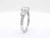 Side-angle view of EFFY 14K white gold three-stone diamond ring showing the pavé shank