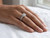 EFFY 14K white gold round diamond halo engagement ring worn on a model’s finger