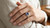 EFFY tanzanite and diamond halo ring worn on a model’s hand
