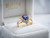 EFFY 14K yellow gold tanzanite and diamond ring displayed inside a luxury EFFY-branded white velvet presentation box