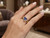 Elegant model wearing EFFY 14K yellow gold tanzanite and diamond statement ring
