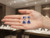 EFFY 14K white gold tanzanite and diamond earrings displayed on an open model palm