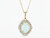 14K yellow gold EFFY Ethiopian opal and diamond double halo pendant necklace, front view on white background