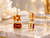 Front view of EFFY 14K gold drop earrings highlighting the lighter top stone and deep Madeira citrine bottom stone