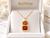 Model holding an EFFY yellow gold Madeira citrine and diamond necklace to showcase the pendant