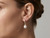 Model wearing a single EFFY 14K yellow gold diamond and freshwater pearl drop earring
