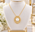 EFFY freshwater pearl and diamond sunburst necklace displayed on an elegant white velvet jewelry bust