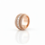 Close up of all around cubic zirconia stones on rose gold tone band ring Atelier Gems