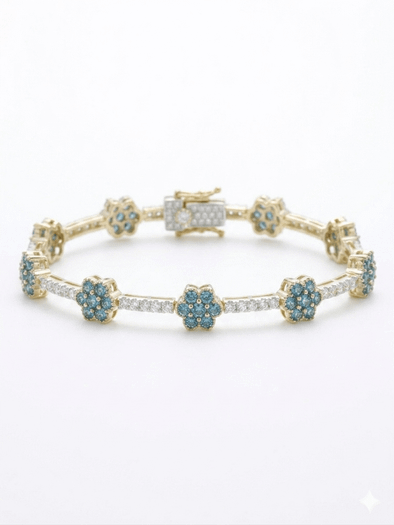 Elegant 14k yellow gold tennis bracelet showcasing six blue diamond floral cluster stations alternating with sleek rows of white pave diamonds.