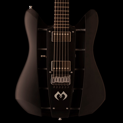 Close-up front view of our Velvet hollowbody in Raven black satin finish. The core has an inlay-free macassar ebony fingerboard and is entirely monochrome colormatched in black satin. Hardware is chrome.