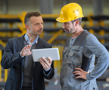 Project manager discussing project with mezzanine installer.