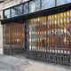 Illinois Engineered Products HYDP1285 Storefront Security Gate - 12' W x 8.5' H, w/ Fixed Top & Folding Bottom