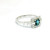 Blue Topaz Halo Ring with Baguette Accents in 18kt White Gold RPG-10382