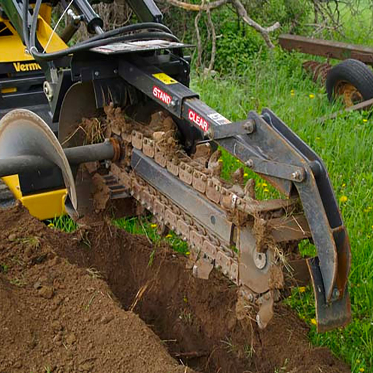 Image of Rototiller with trencher attachment in a field