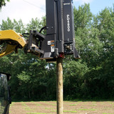 Bradco PD4800 Skid Steer Post Driver Attachment installing fence post