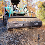 Compacting a driveway with the Bradco vibratory roller attachment from Paladin.