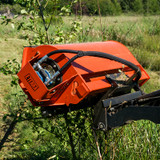 Eterra Sidewinder Mini Skid Steer Flail Mower clearing brush and small trees