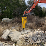 CID excavator hydraulic breaker in use.